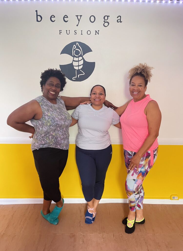 three friends attend classes together at Bee Yoga Fusion