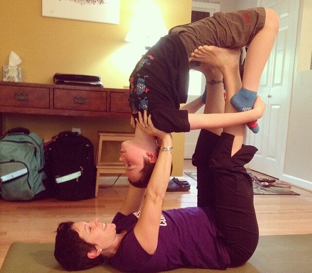 gretchen doing acroyoga with her child