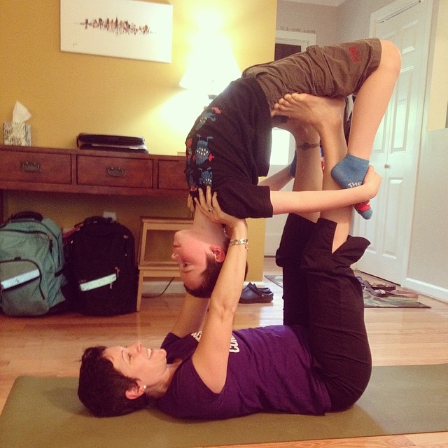 gretchen doing acroyoga with her child
