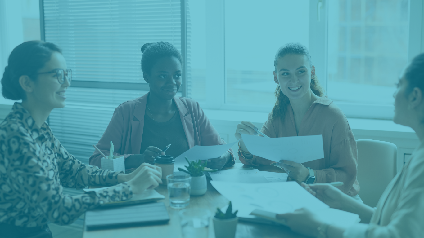 group of women talking at a business mastermind group
