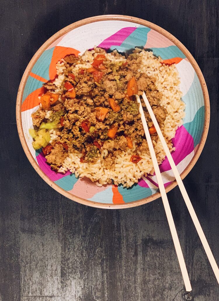 ground turkey with veggies served over rice in a teriyaki sauce