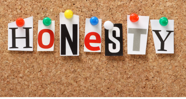 a bulletin board with the word HONESTY pinned