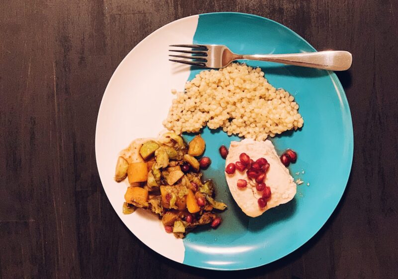 pomegranate honey glaze over swordfish with cous cous and roasted veggies