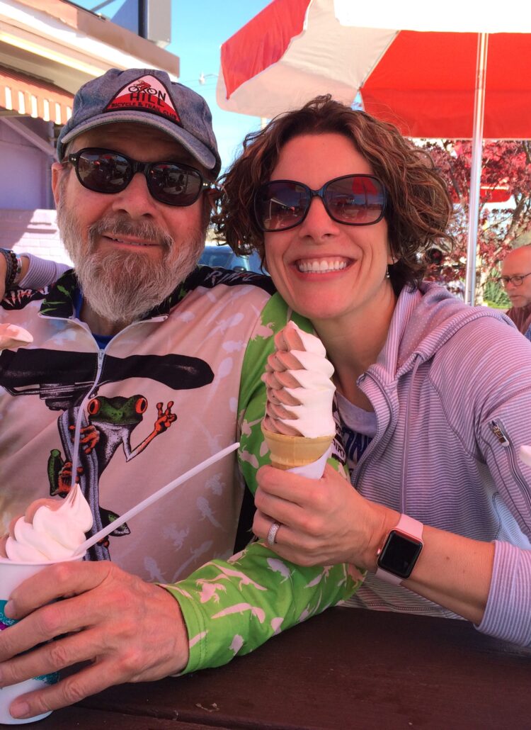 Gretchen Schock with her dad enjoying an ice cream cone after a long bike ride