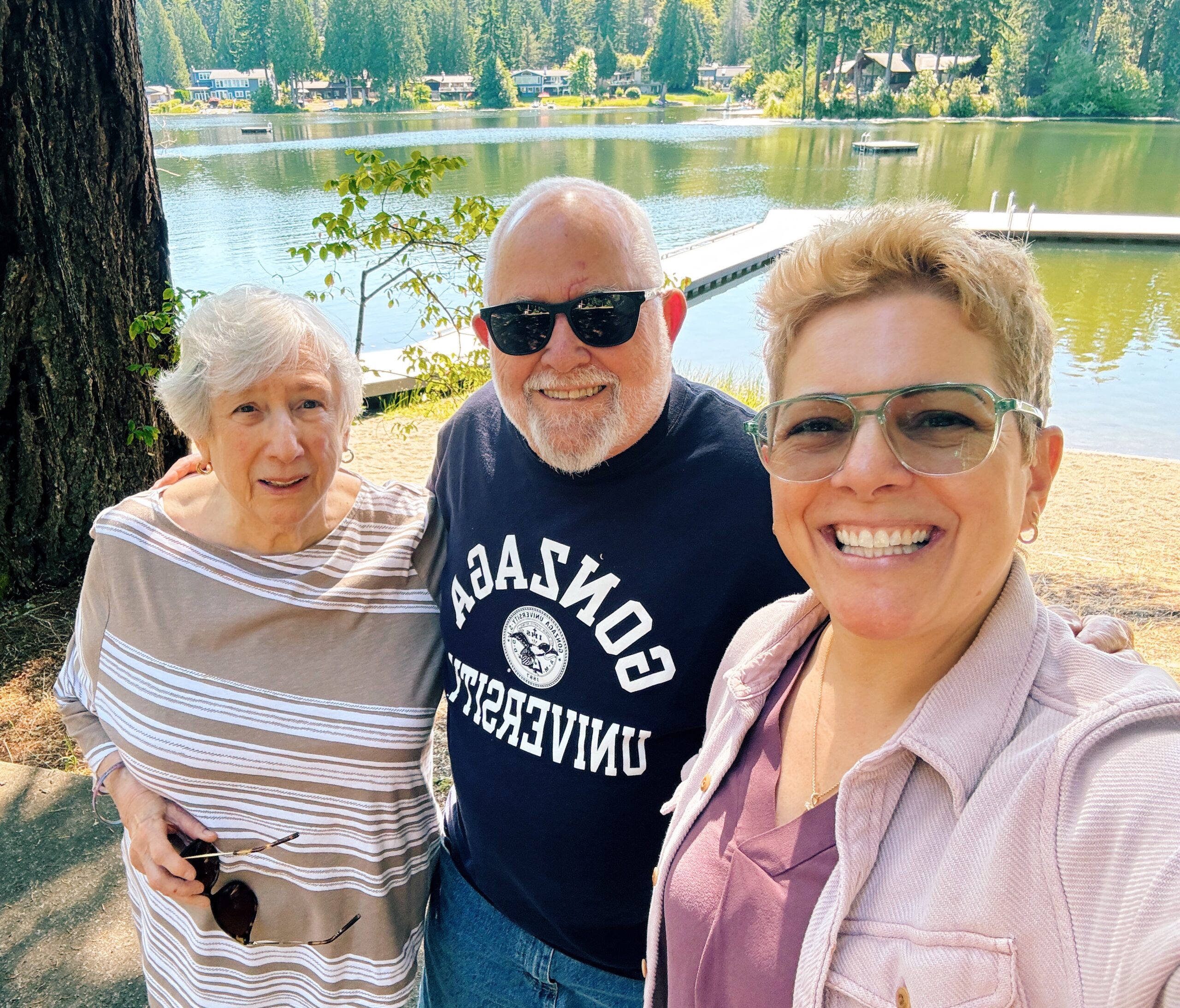 gretchen schock with her aunt and uncle with a lake in the background