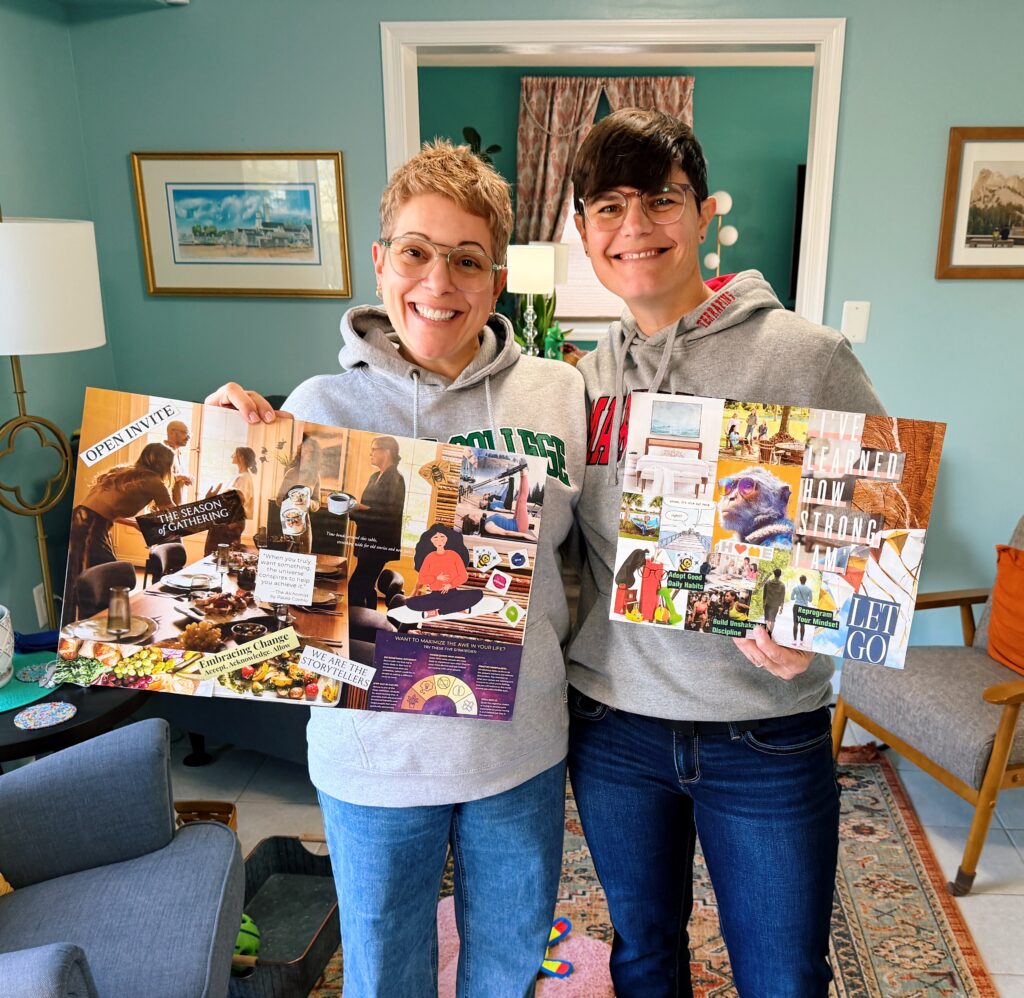 My wife lauren and I holding up our vision boards for 2026