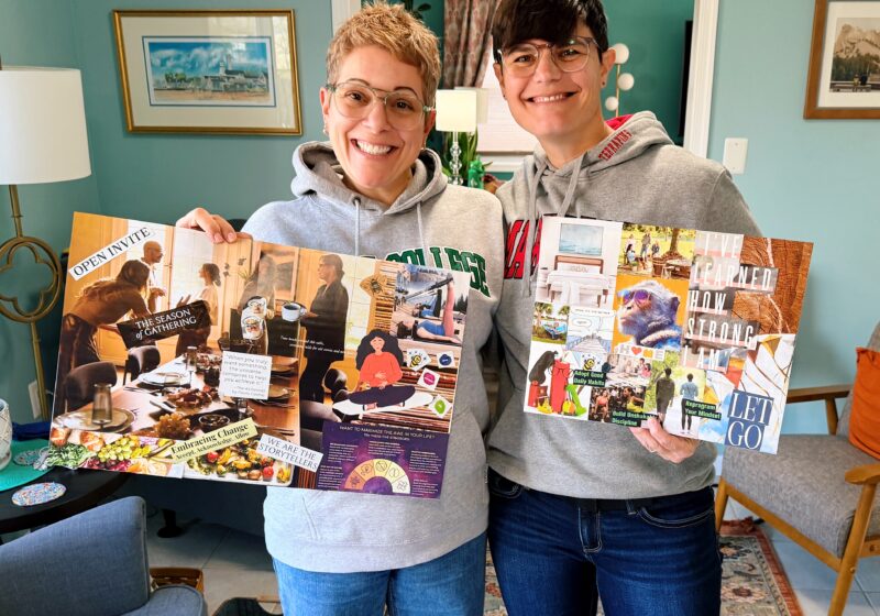 my wife lauren and i holding up our vision boards for 2026 and smiling broadly