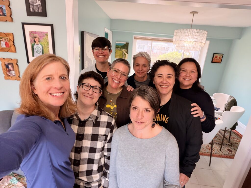 Club bowie gathering table, a group of lesbian women of various races but all around the same age.
