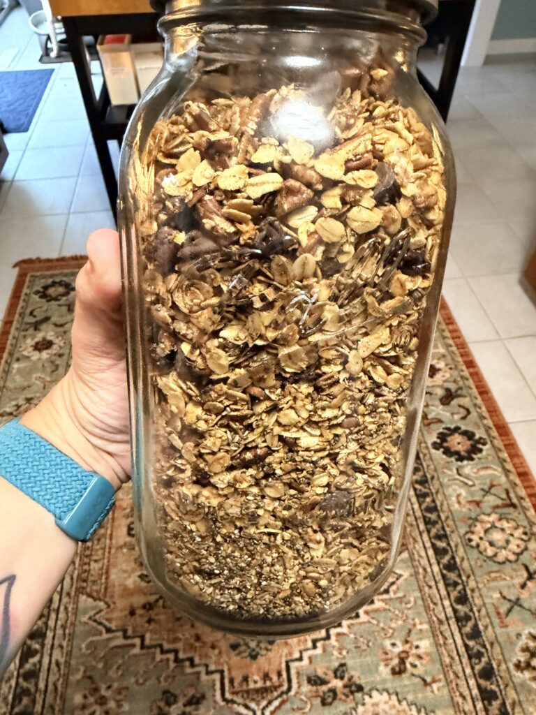a large mason jar full of the granola recipe.